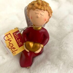 Gilde Angel Figurines and Ornaments. Item no: 28002. Boy kneeling holding heart.